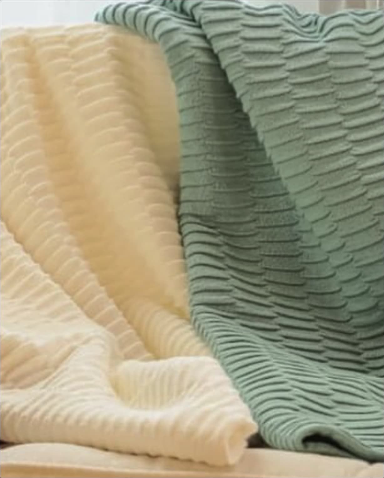 Cream and green quilts with wave texture
